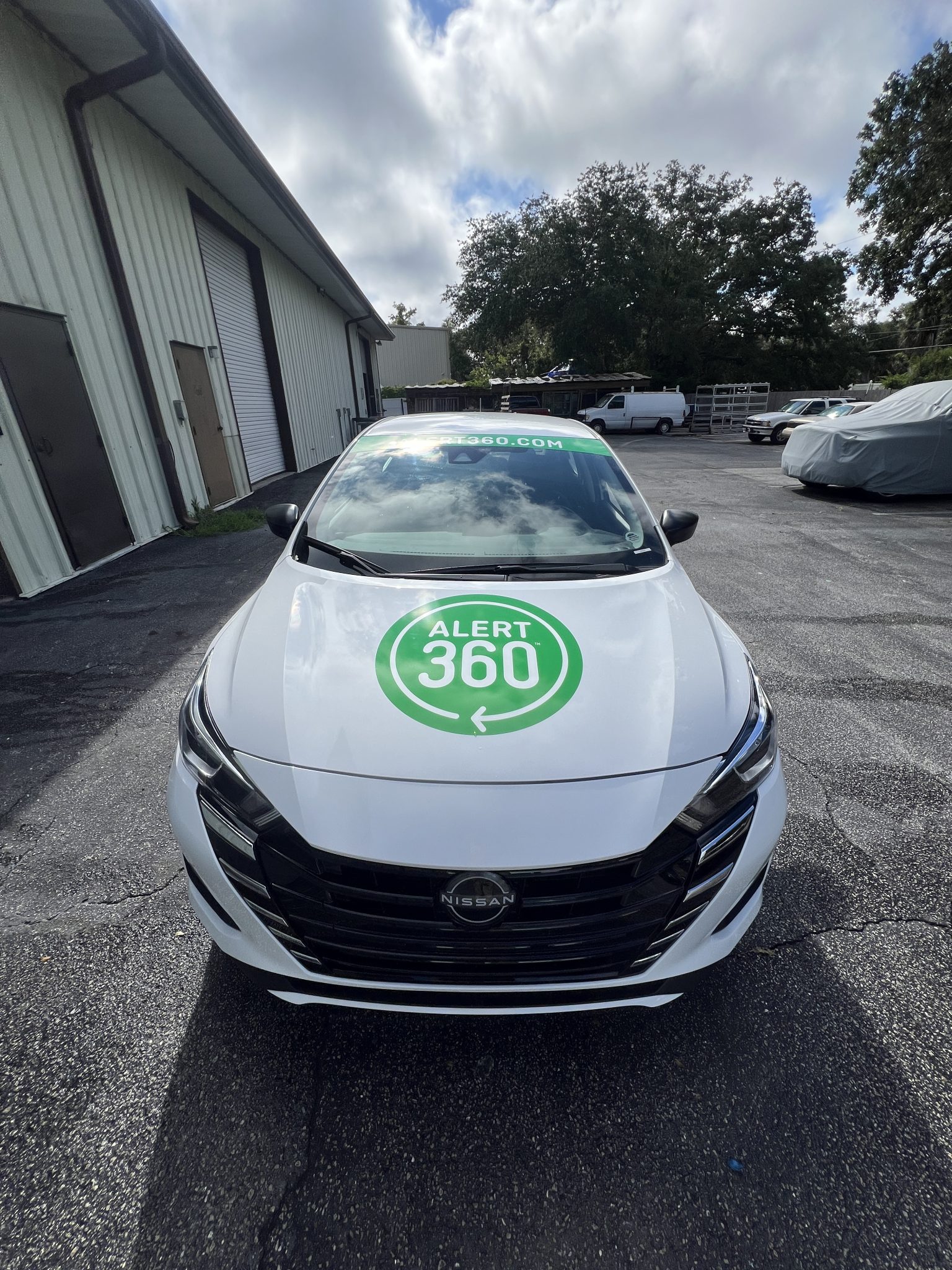 Branded commercial vehicle wrap for Alert 360 featuring custom printed graphics designed to create a professional and highly visible mobile advertising presence.