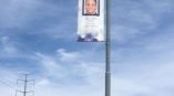 Pole banner with image of fallen police officer and