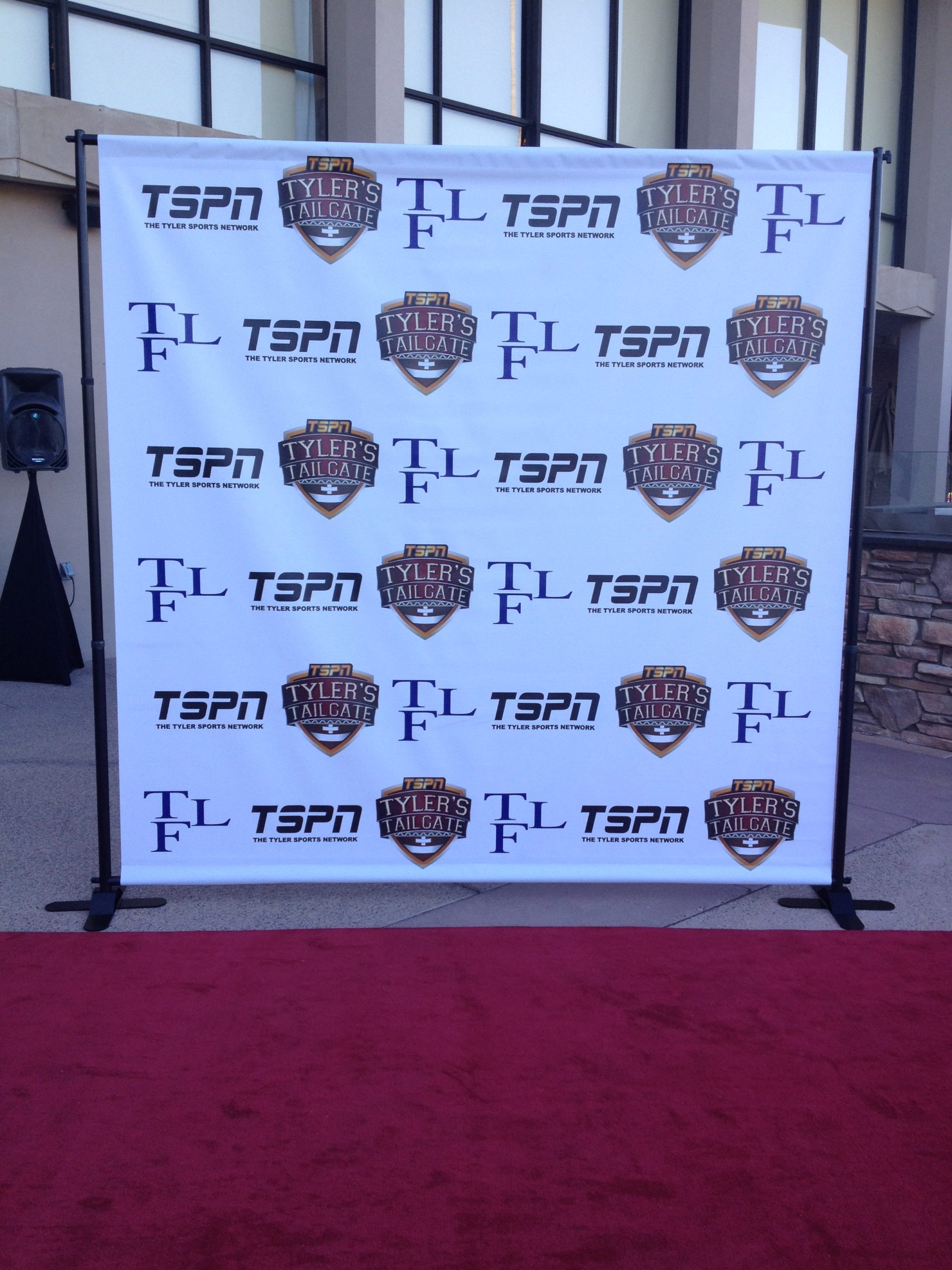step and repeat banner backdrop that says 