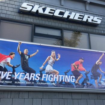 Banner for Skechers that shows people in various outfits biking