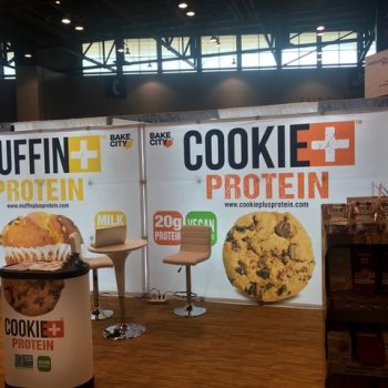 trade show display with "bake city" branding for muffins and cookies