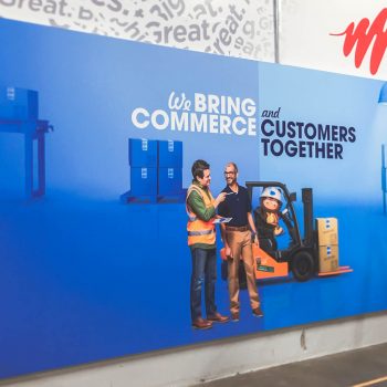 mural that says "We Bring Commerce and Customer Together"