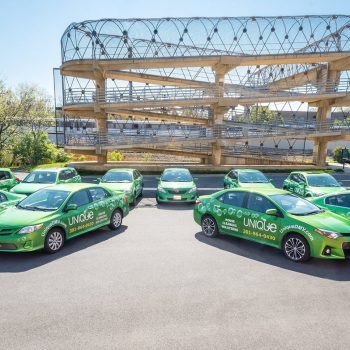 fleet of Unique DMV branded cars