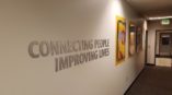 Connecting People Improving Lives office signage