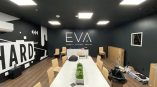 Office wall mural featuring bold graphics and 'EVA ESPORTS VIRTUAL ARENAS' text on black background.