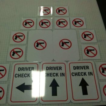 Driver Check-in and gun free signs