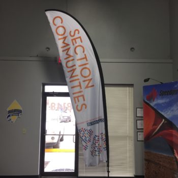 Banner inside of an office building for Section Communities 