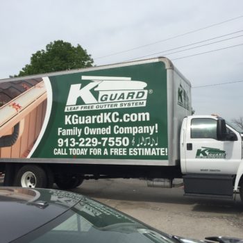 Vehicle wrap on large truck for K Guard Leaf with an image of a gutter, logo, and contact information 