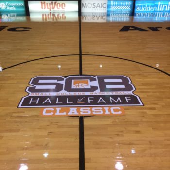 Decal in the middle of a gym floor for Small College Basketball Hall of Fame featuring their logo 
