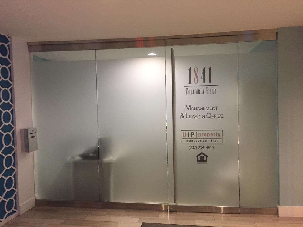 Management and leasing office detail on frosted glass door