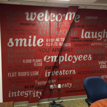 Red wall with gray and white printed decals