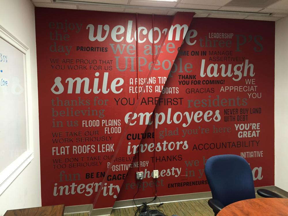 Red wall with gray and white printed decals
