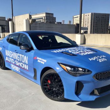 Front view of Washington auto show blue car wrap 