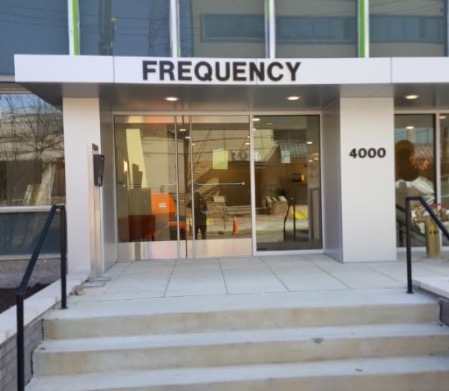 frequency sign above enterance to building