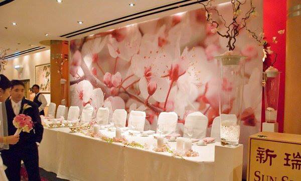 Dining setup in front of full wall pink flower mural