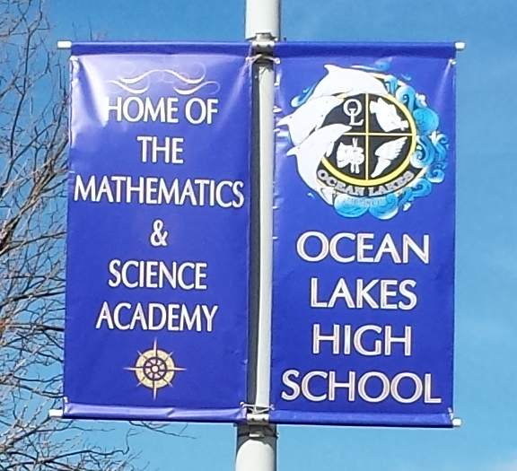 Ocean Lakes High School blue banner on lamp post