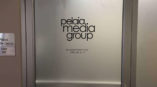 Pelia Media Group glass door graphic