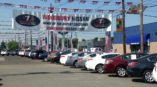 Woodbury Nissan hanging banner in car lot 