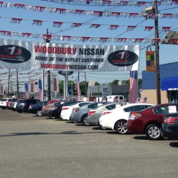 Woodbury Nissan hanging banner in car lot 