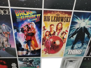 Advertising posters displayed on a wall