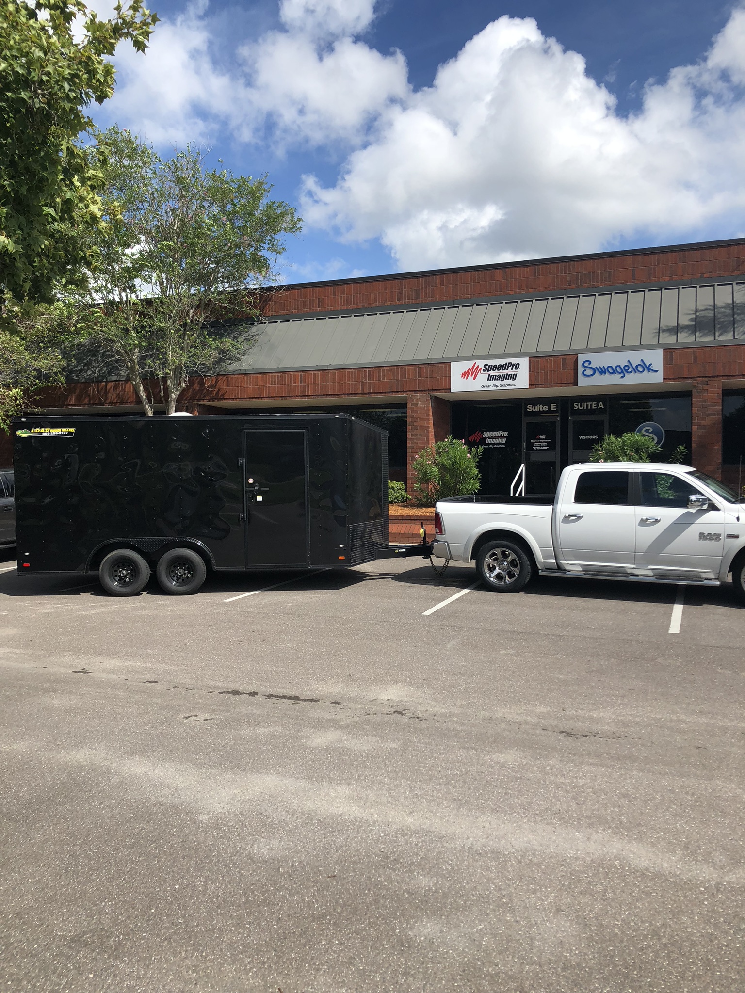 solid black trailer wrap with white truck 