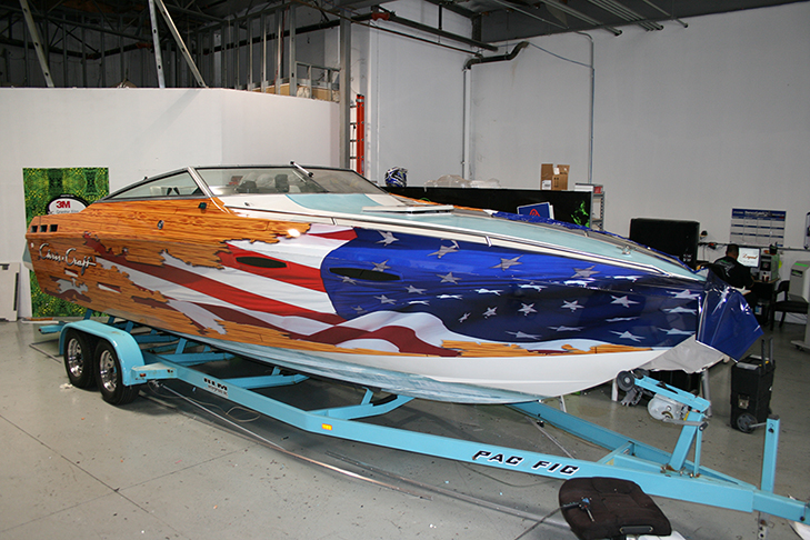 boat wrap with flag breaking through wood