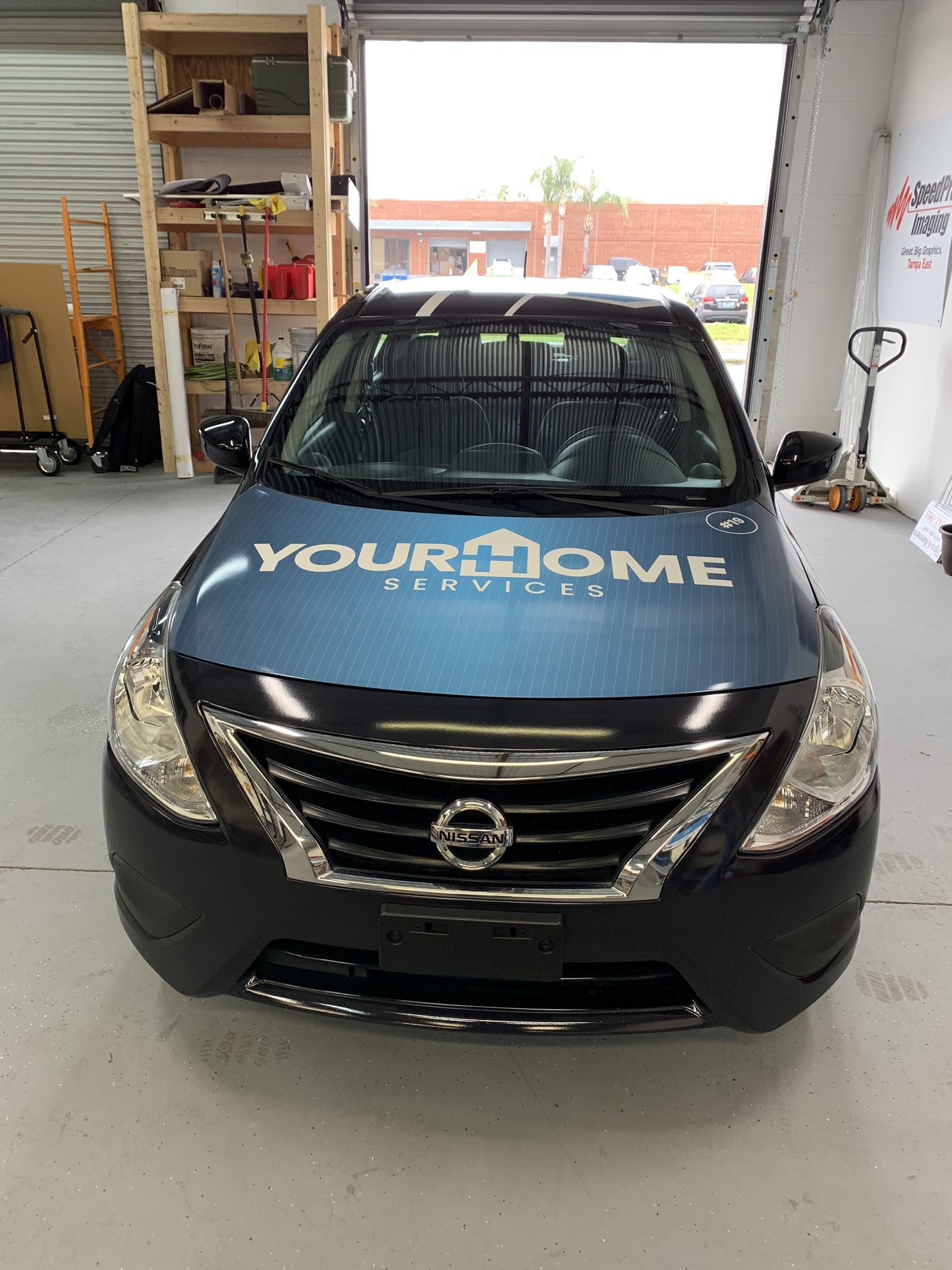 your home services nissan wrap in blue 