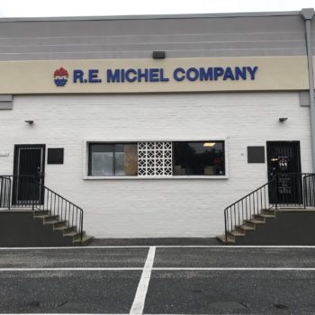 Outdoor sign on the front of the building for R.E. Michel Company 