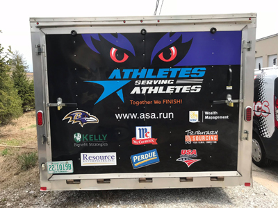 Back of Athletes Serving Athletes trailer featuring decals created by SpeedPro 