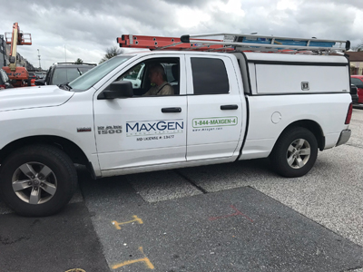 Car decal for MaxGen Energy Services on a white truck created by SpeedPro 