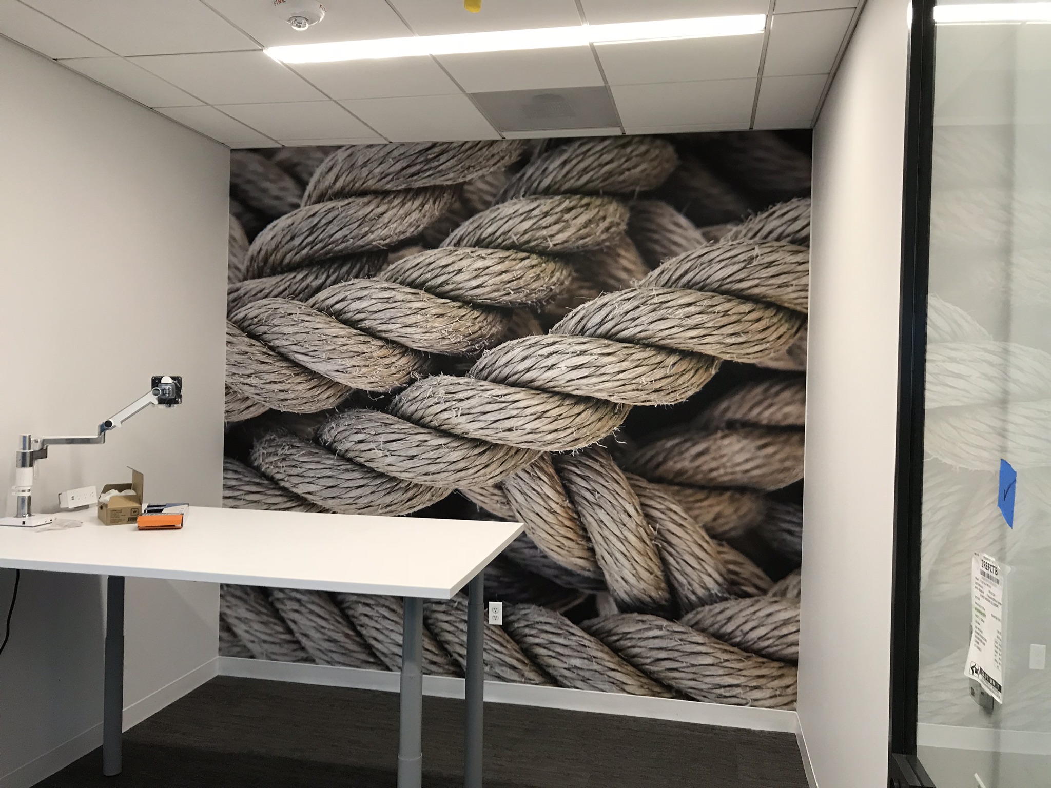 Wall mural of rope in an office space created by SpeedPro 