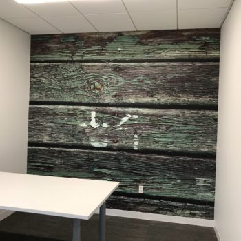 Wall mural of large wooden planks in an office created by SpeedPro 