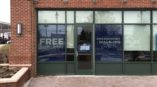 Window sign curb graphics advertising free exams & x-rays for Aspen Dental 
