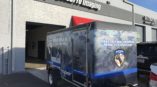 Trailer with vehicle wrap for Blue Line K-9 Dog Training with graphics of German Shepherds 