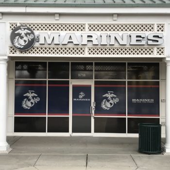 Window decal for the Marines featuring large red and blue stripes and their logo 