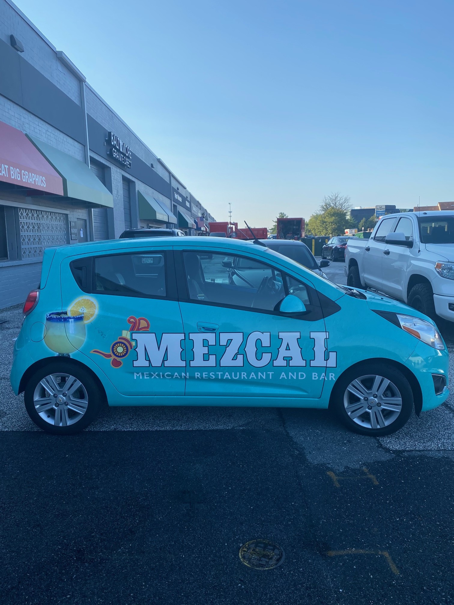 MezCal Branded Blue Car