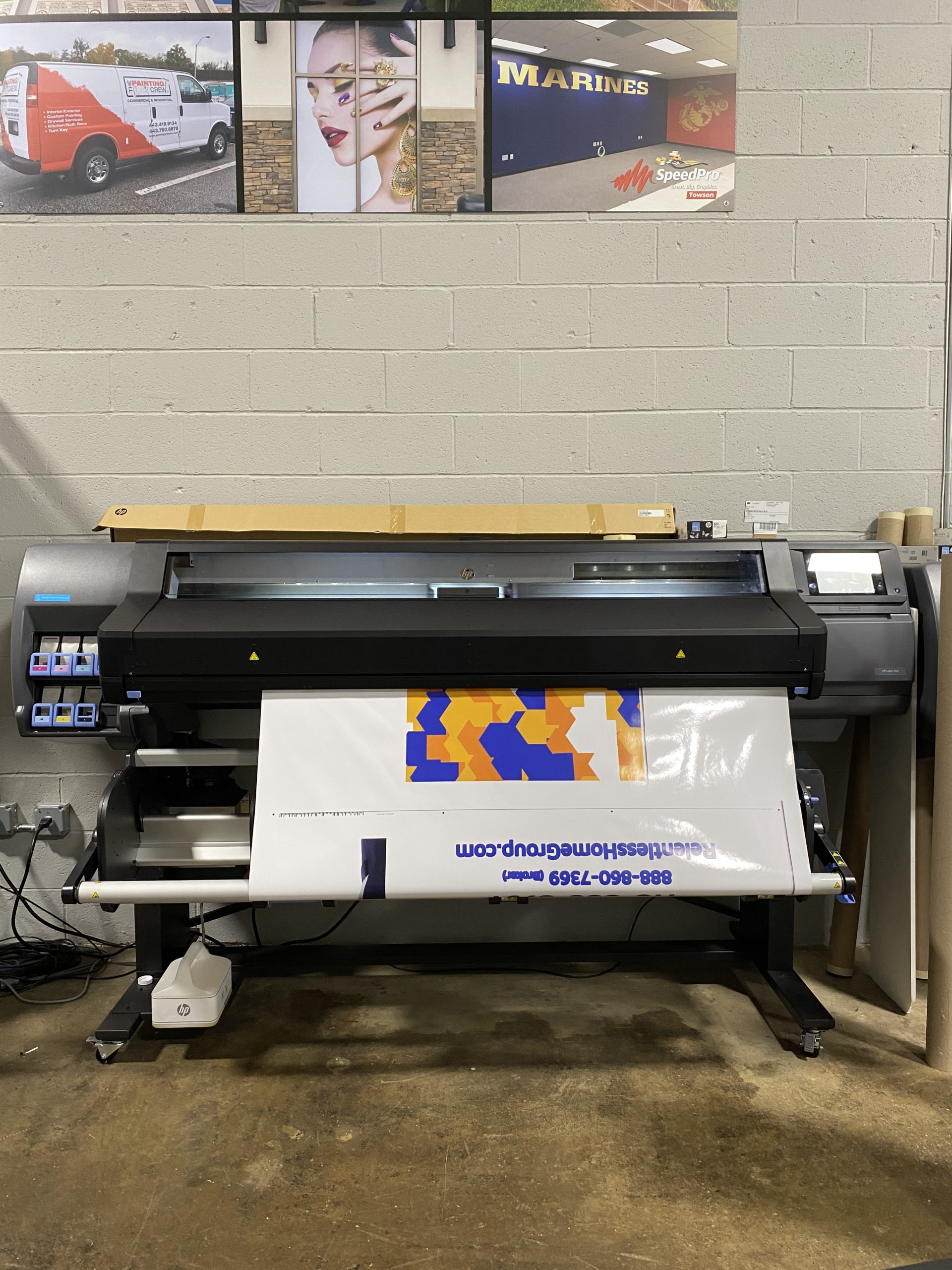 Large Printer Printing a Sign