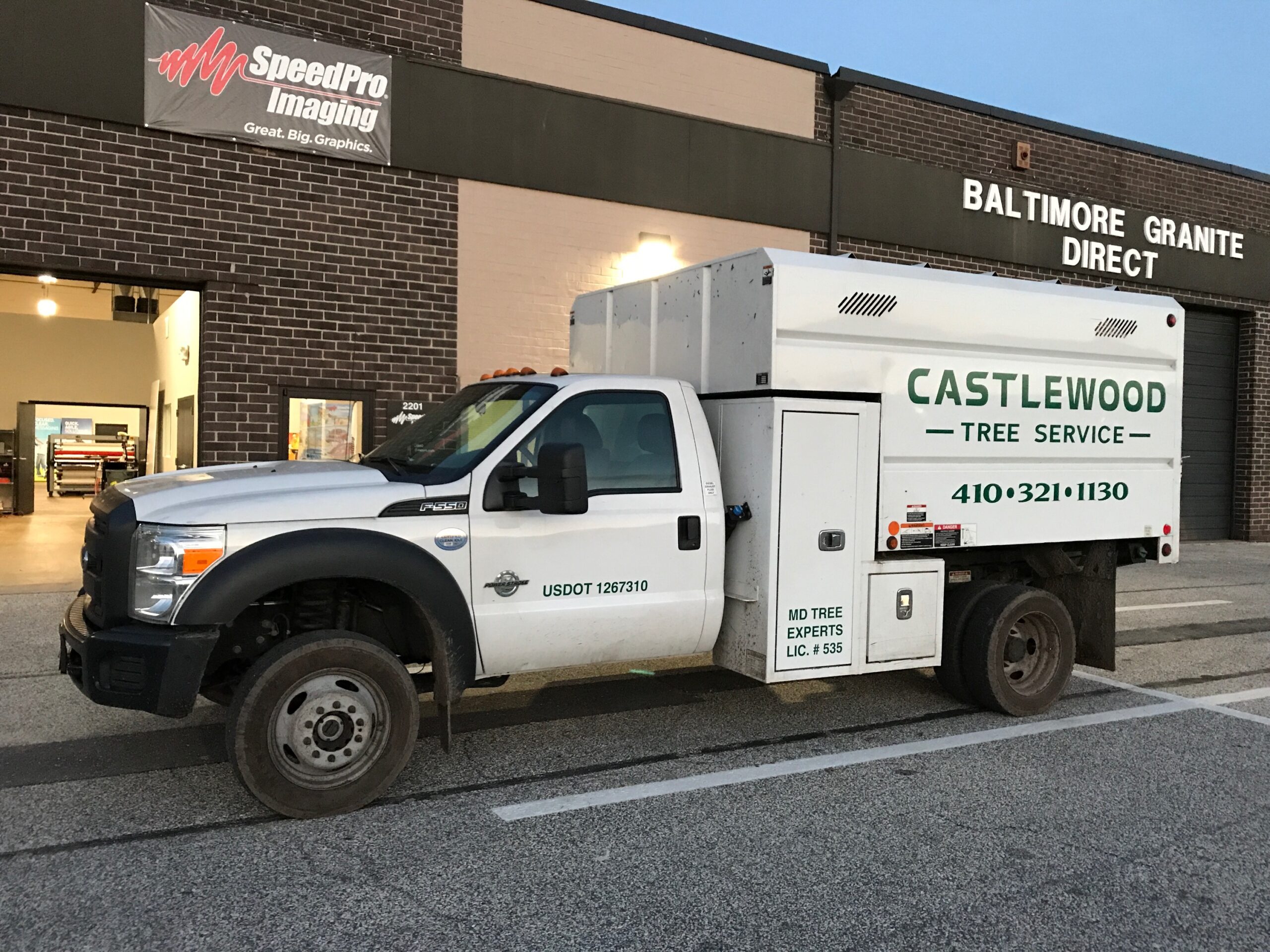 Castlewood Tree Service Truck in Front of SpeedPro Imaging