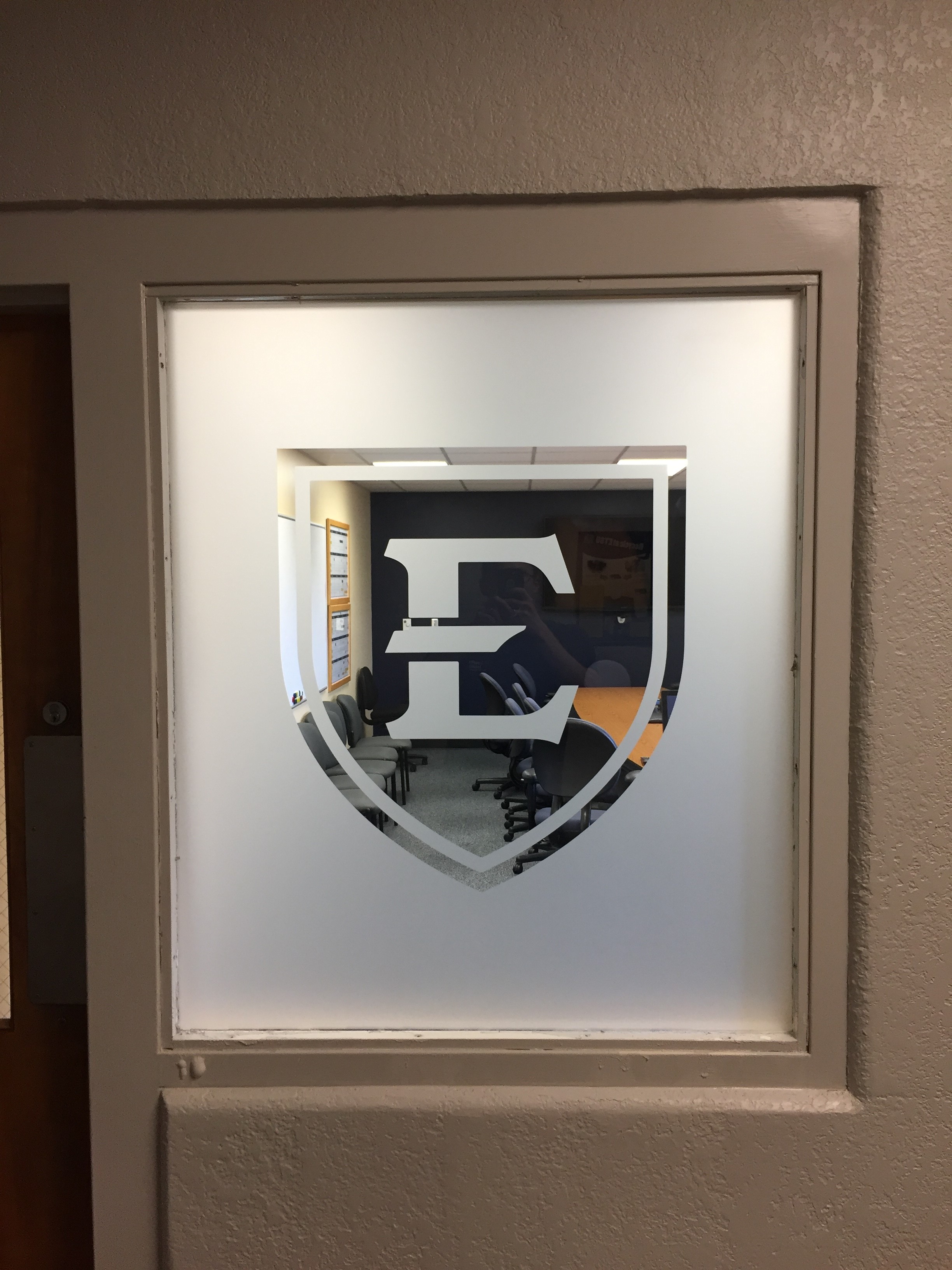 ETSU etched vinyl logo on glass window