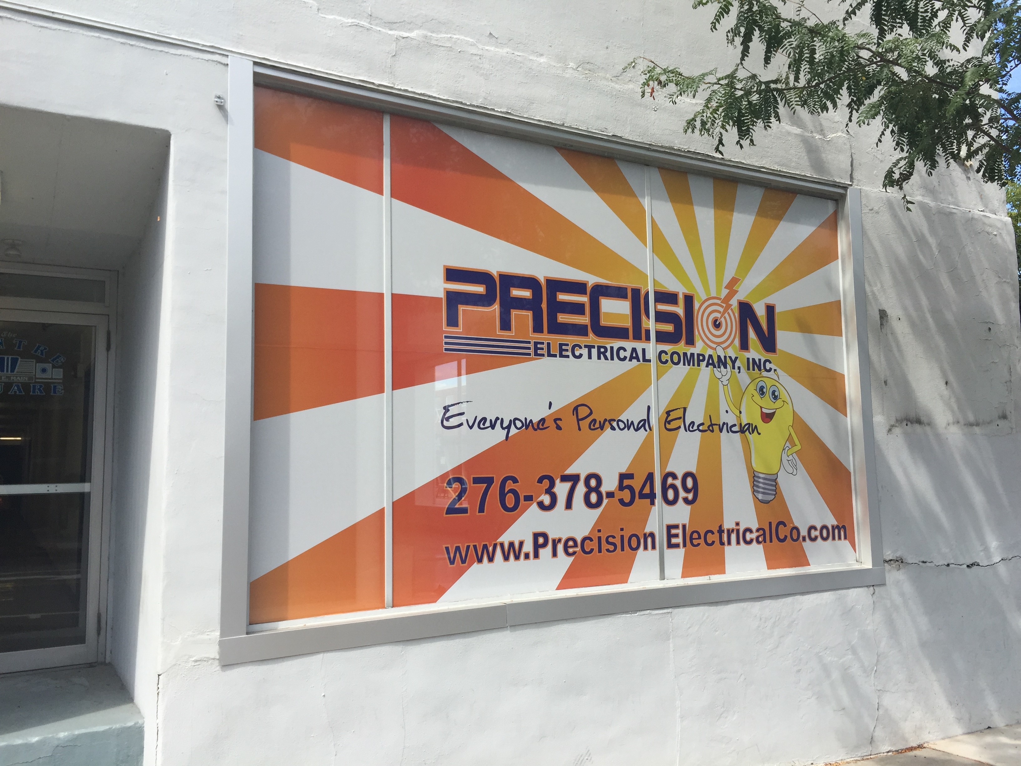 Precision Electrical Company window graphic advertisement