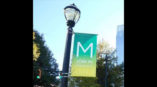 Green and yellow midtown.com banner