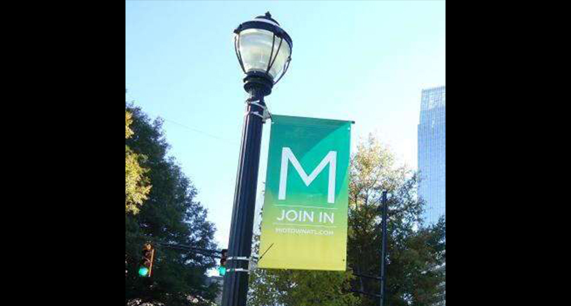 Green and yellow midtown.com banner