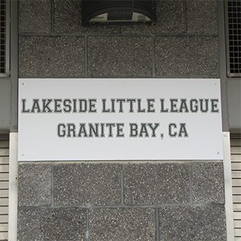 Lakeside Little League sign on the side of a building