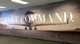 wall graphic that says Take Command