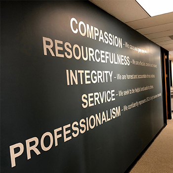 compassion, resourcefulness, integrity wall graphic