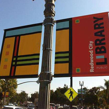 Redwood City Library banner on a lightpost