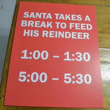 Board announcing Santa's schedule