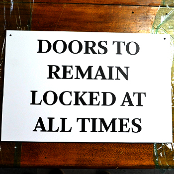 Sign instructing people to keep doors locked