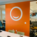 orange and white wall graphic in an office