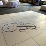 floor graphic of a monogrammed "R"